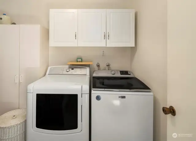 The laundry room is huge with additional storage off to the left of this picture.