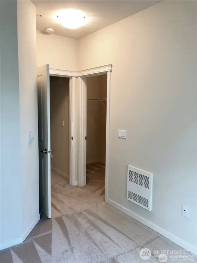 This is the view in the second bedroom back toward the door and walk-in closet.