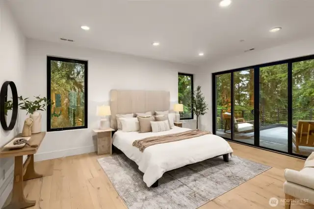 Primary luxury bedroom with private patio with mountain views