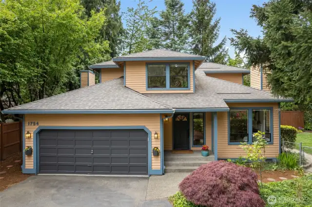 View of home and 2-car garage
