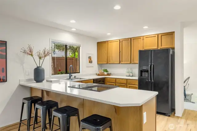 Space for bar seating and a kitchen table