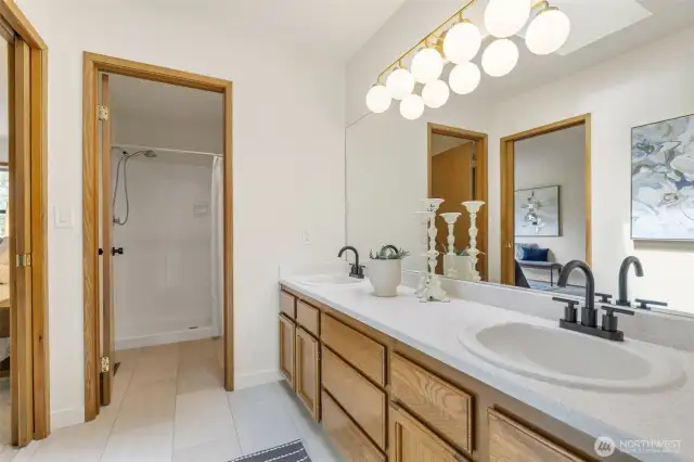 Looking towards shower and toilet. Double vanity!