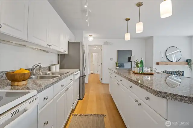 The kitchen flows effortlessly into the rest of the home, creating a functional and harmonious layout ideal for both everyday living and effortless entertaining.