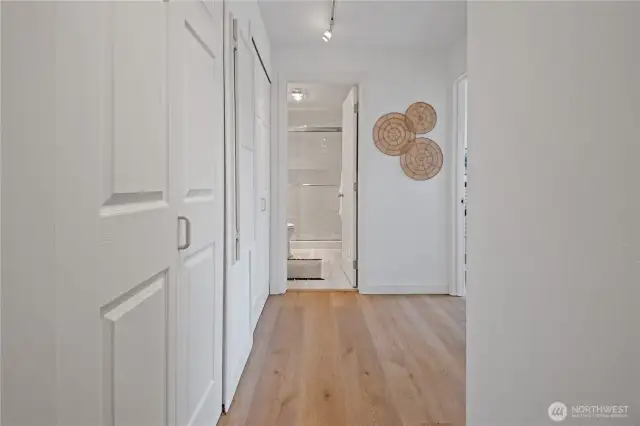 The hallway leading to the bedrooms and bathroom is lined with ample storage, thoughtfully designed to meet your everyday needs with convenience and ease.