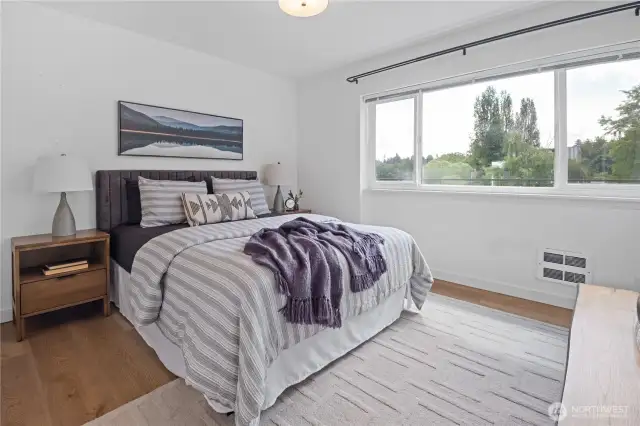 The primary bedroom offers generous space and more of those stunning water views—a serene and calming backdrop that sets the stage for a restful night’s sleep.