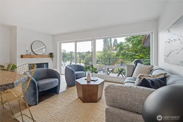 The living room features floor-to-ceiling sliding doors that seamlessly connect you to your expansive deck, where breathtaking water views surround you from sunrise to starlight.