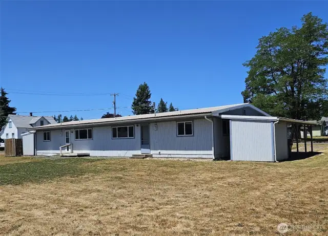 Back yard with small back porches & access doors.