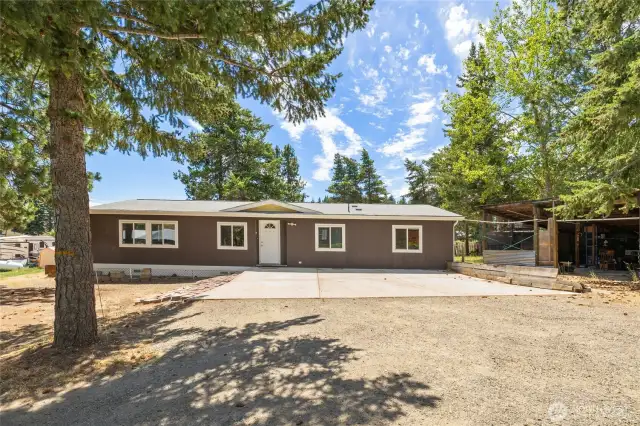 Home has a great concrete parking pad and you could use the shed as a carport for covered parking!