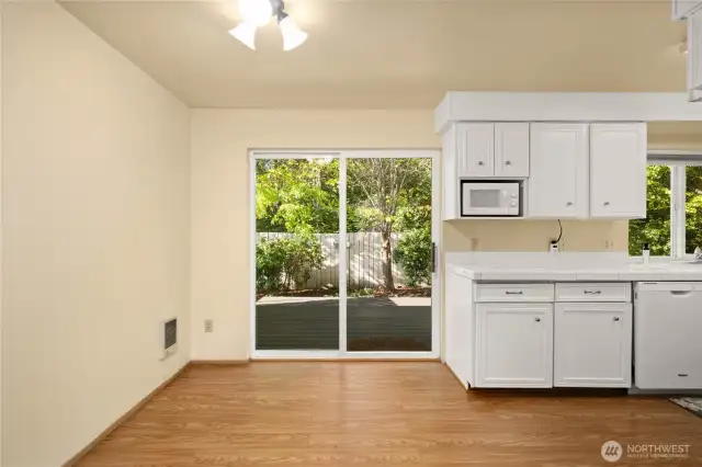 Nice dining space at the end of the kitchen and access to Trex deck through the sliding glass door.
