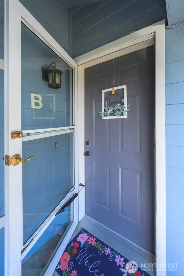 Welcome home. Heavy duty storm door covers the front door.