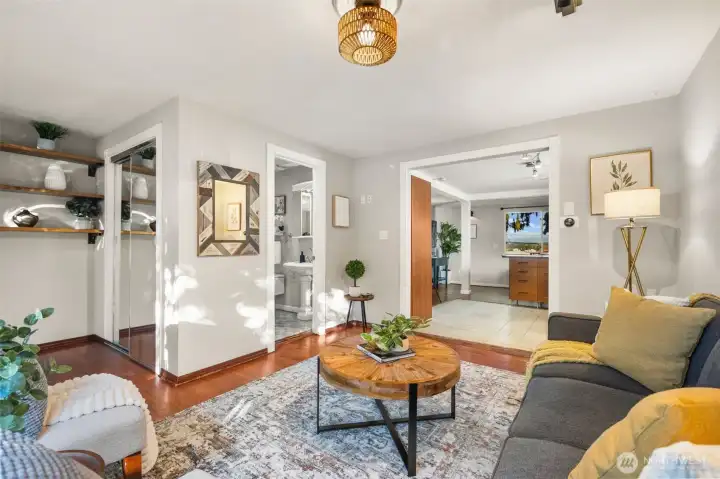 Function meets form with a coat closet just inside the front door, and beautiful shelving units to display books, photos, or treasures!