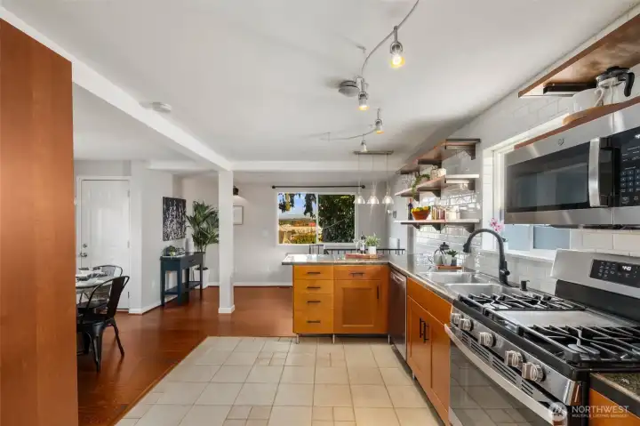 Enjoy the natural flow of the home welcoming you from the living room into the kitchen and dining areas. PLUS, the eastern view provides gorgeous morning light and views.