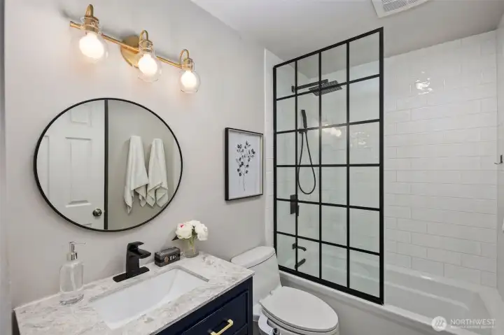 Completely remodeled full bathroom is straight out of a magazine.