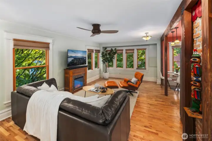 2nd floor living room with expansive city views. And beautifully trimmed trees embracing the home.