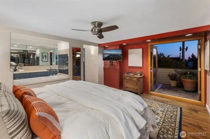 Expansive top floor primary suite with city views patio and rooftop deck