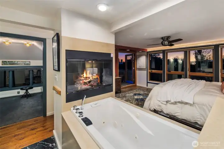 Top floor primary suite with sitting space and rooftop deck and two expansive walk in closets with storage.