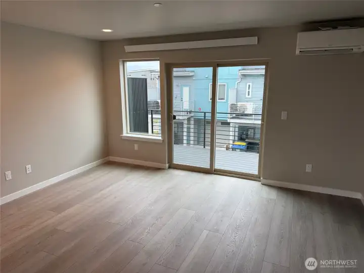 Living area with slider to deck