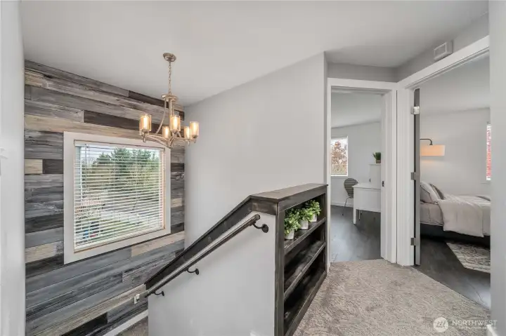 Head upstairs to find three spacious bedrooms .