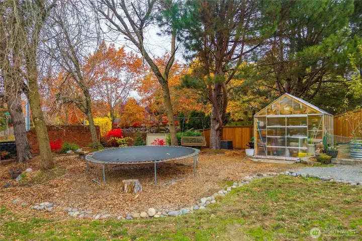 Stunning fall foliage shows the beauty of this backyard oasis!