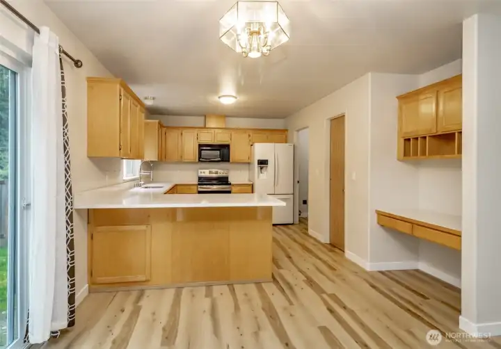 Kitchen with backyard entrance and desk area