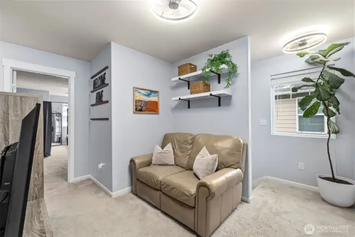 This upstairs mini loft is a great spot for TV, and video games. Or a cozy reading nook!