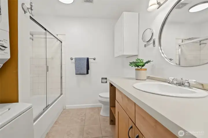 Full bathroom with washer/dryer unit