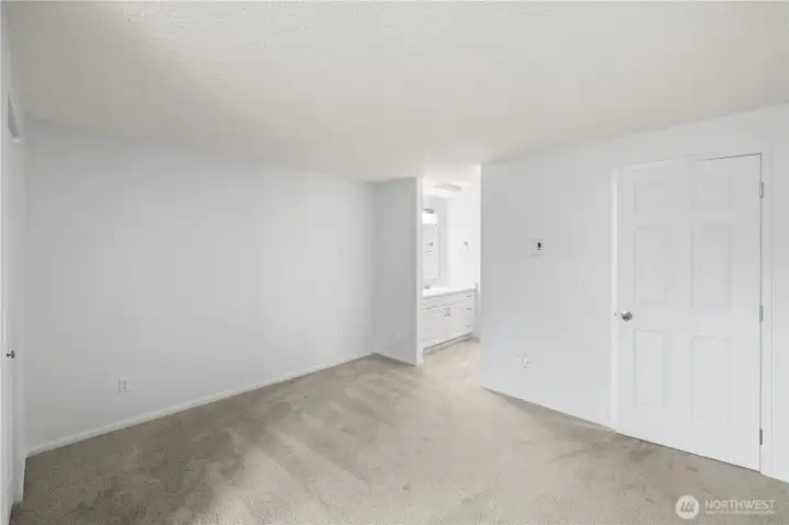 Entry to vanity in primary bedroom