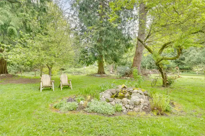 Multiple fruit trees, grapes, berries & gardens!