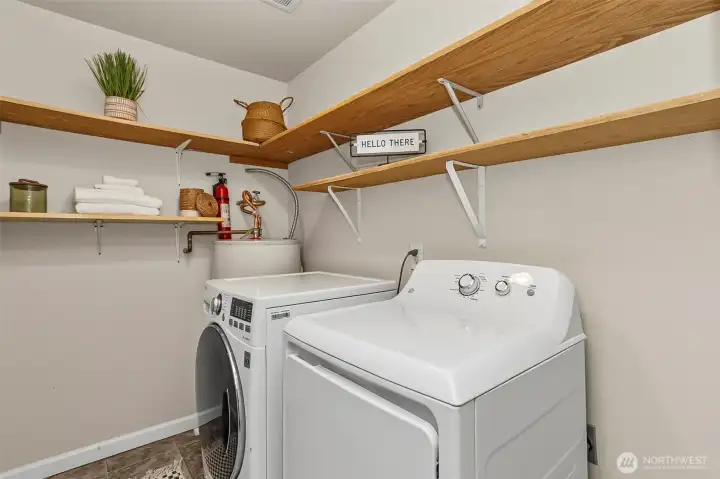 Laundry room with shelves for storage