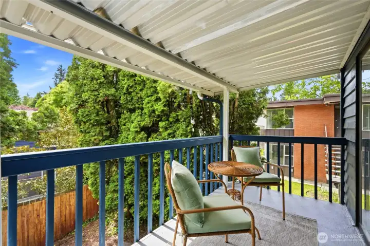 Enjoy relaxing on the covered deck off the kitchen/dining area.