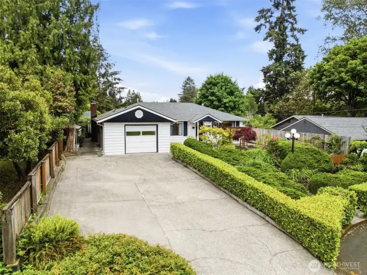 Spacious driveway with ample off-street parking and easy access to the attached garage.