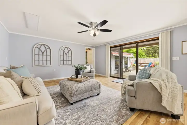 Large windows frame tranquil garden views throughout the home.