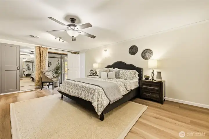 Generous primary bedroom easily accommodates a king-sized bed and additional furnishings.