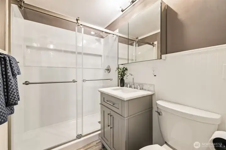 The additional bathroom includes a convenient walk-in shower.