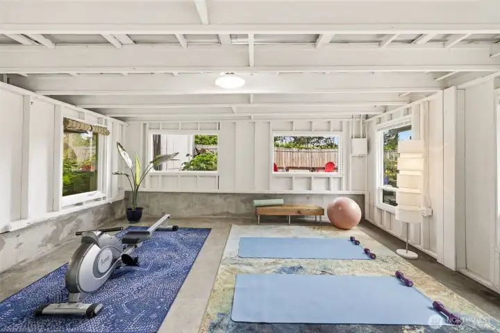 Covered patio offers year-round outdoor living and wellness space.