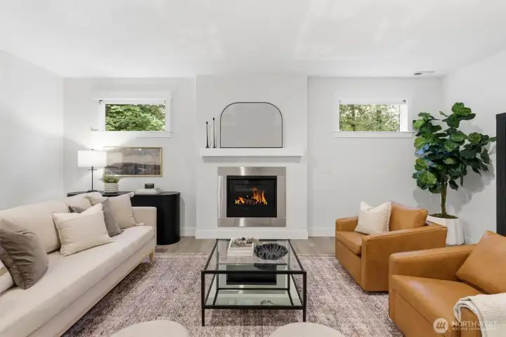 A sleek gas fireplace anchors the main living space.