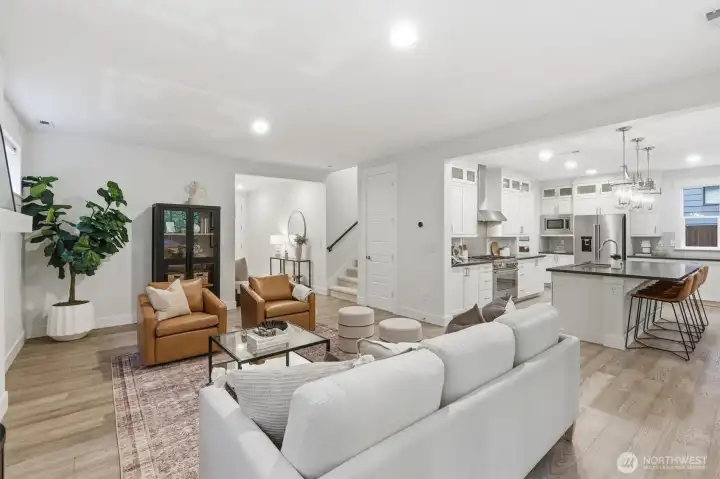 Open Concept Living: Soaring 9-foot ceilings, seamless sightlines, and abundant natural light create an airy, expansive atmosphere for everyday living and entertaining.