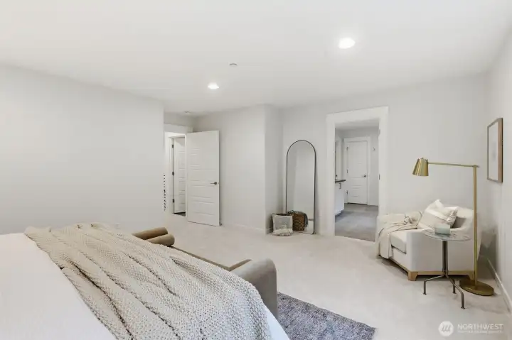 Designed for comfort and relaxation, the primary suite feels both spacious and serene.
