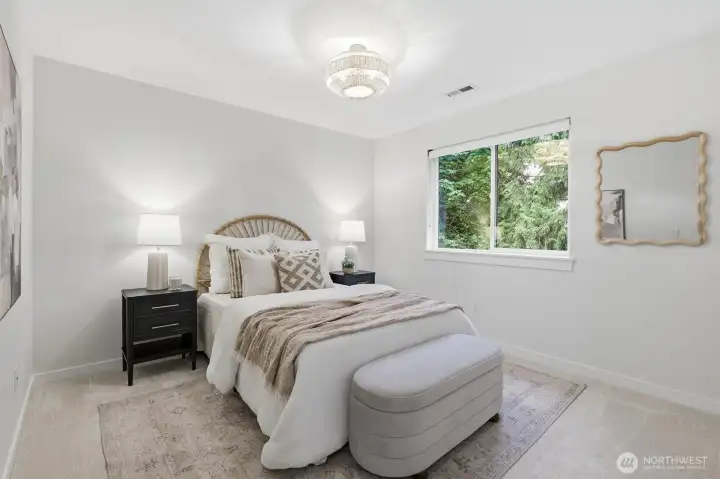 Peaceful natural views and soft light create a calm, comfortable bedroom retreat.