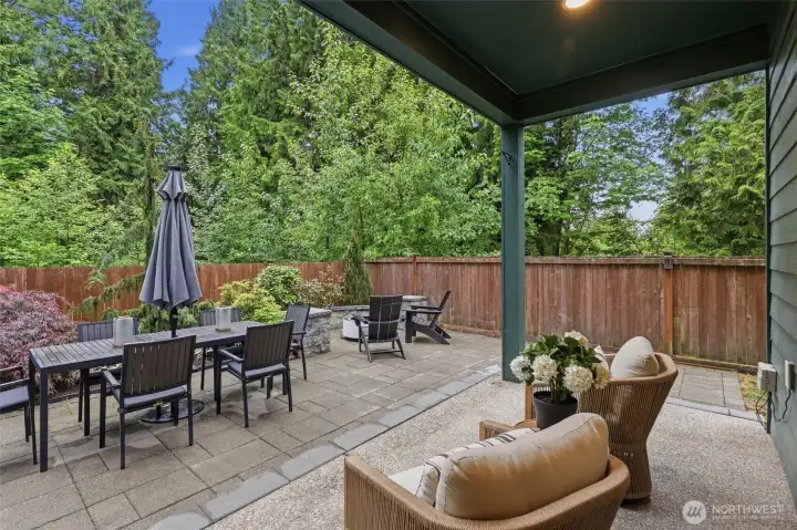 Custom paver patios and covered outdoor living spaces were thoughtfully designed to maximize year-round entertaining and everyday enjoyment.