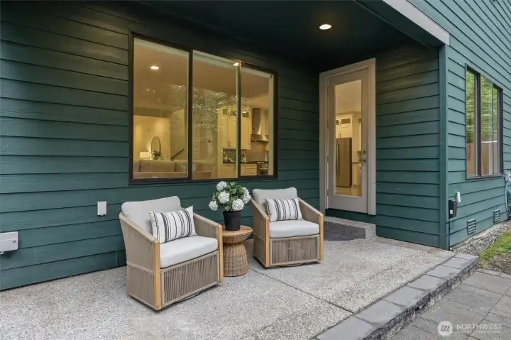 Covered outdoor lounge space creates a seamless extension of the home, perfect for morning coffee or winding down at the end of the day.