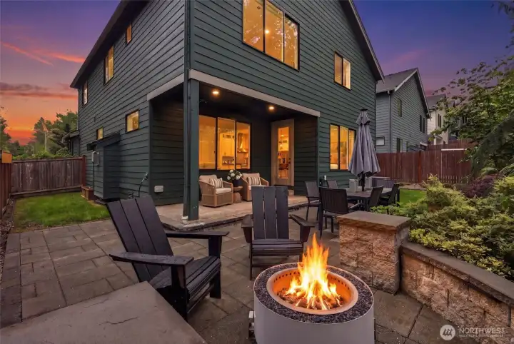 Imagine summer BBQs, evenings by the fire, and s’mores under the trees in this private, entertainment-ready backyard retreat.