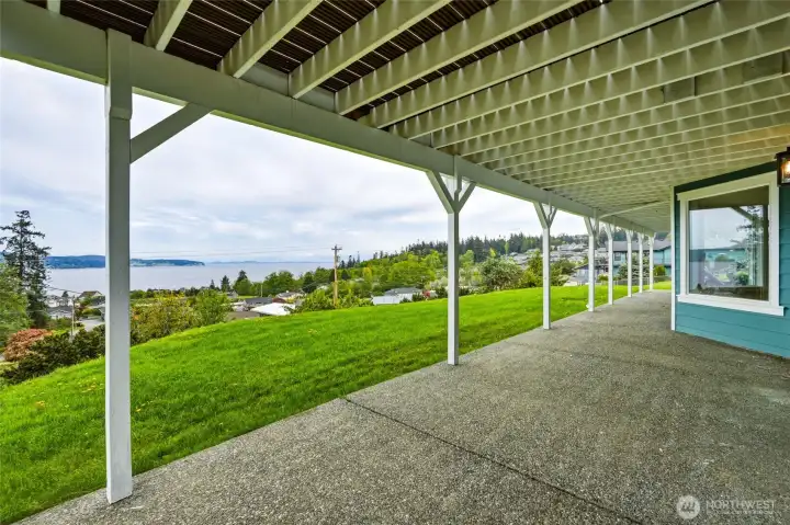 Expansive, dual access lower patio