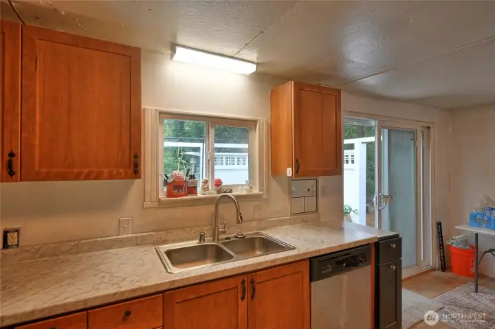 Kitchen  area- All appliances stay and a sliding door to the back porch