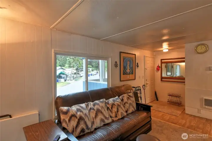 A view of the living room and front door