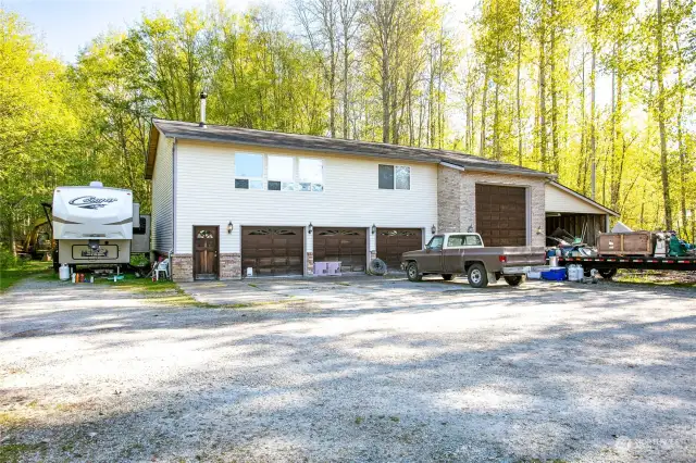 4-bay garage with large shop in back. Large bay can hold a 40-foot RV. All comletely heated. 1400 square foot apartment above.