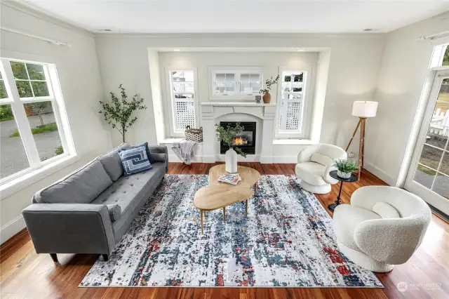 The cozy gas fireplace with built-in window seating in the spacious living room.