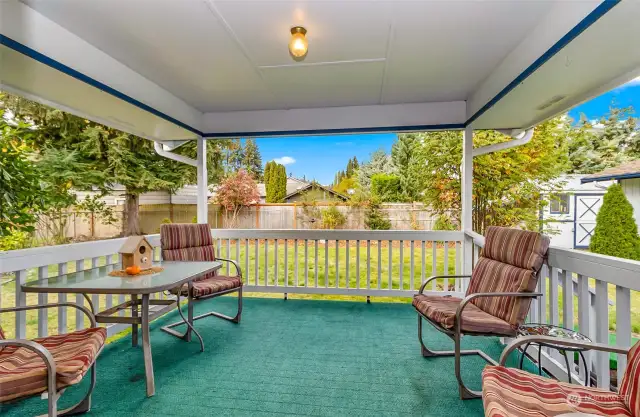 Covered back patio with ramp.