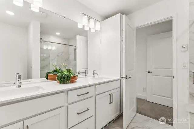 Gorgeous Primary bath featuring tile flooring & quartz countertops.  colors and features may vary