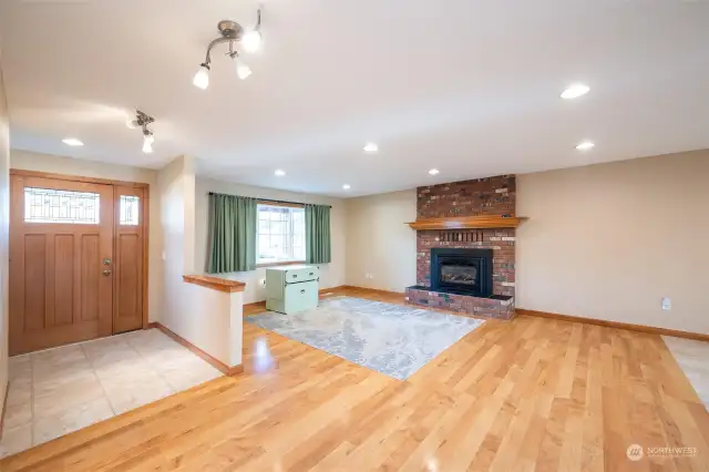 Front door leads into living room with natural gas fireplace.